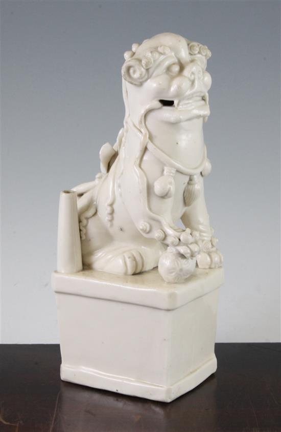 A Chinese Dehua blanc de chine Buddhist lion figural jos-stick holder, Kangxi period, 27.5cm